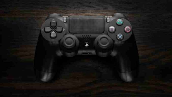 High-resolution image of a Sony DualShock 4 game controller against a dark wooden background. - High-resolution image of a Sony DualShock 4 game controller against a dark wooden background., tags: und xbox - pexel